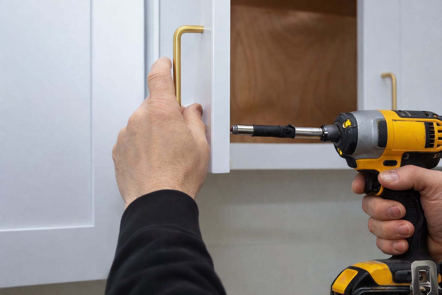 Fitting a new brass handle to a freshly sprayed kitchen door